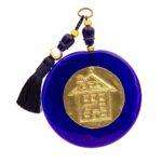 Μπλέ γυάλινη πλάκα με μπρούτζινο πάφυλλο σπιτάκι